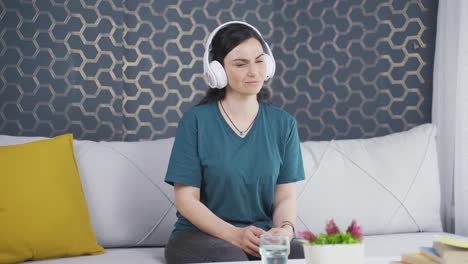 Unhappy-woman-listening-to-music-with-headphones.